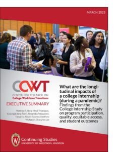Image of report cover. Photo is of students of various identities speaking with employers at an internship fair.